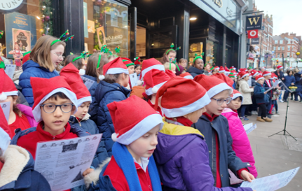 Carol singing December 2025